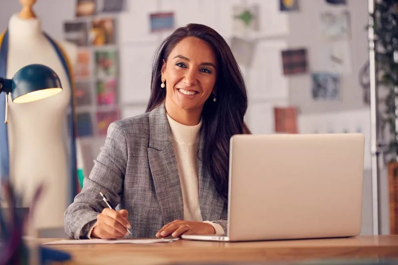 small business owner boss lady looks at you like why are you bothering me while I'm trying to come up with our small business brand?